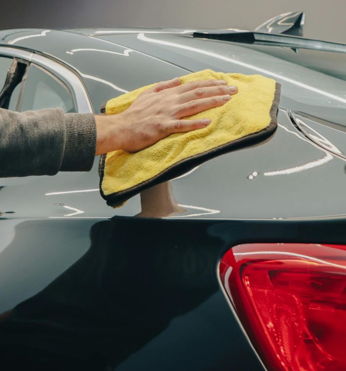 Photo by Esmihel Muhammad on <a href="https://www.pexels.com/photo/hand-wiping-a-car-with-a-cloth-14615260/" rel="nofollow">Pexels.com</a>