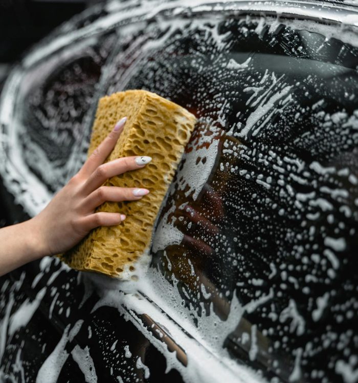 Photo by Tima Miroshnichenko on <a href="https://www.pexels.com/photo/photo-of-a-person-cleaning-the-window-of-a-black-car-6873088/" rel="nofollow">Pexels.com</a>